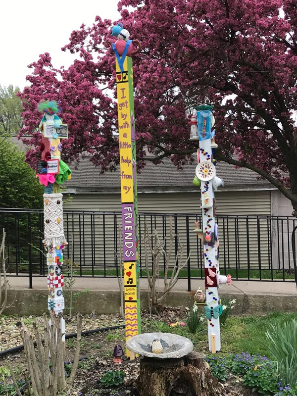 SCCC story poles tell the story of the Springfield Ceramics and Crafts Club.